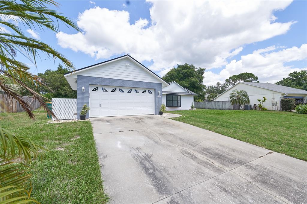 119 Ridgecrest Drive Eustis, FL 32726 - Photo 3 of 52 a view of white house with a yard