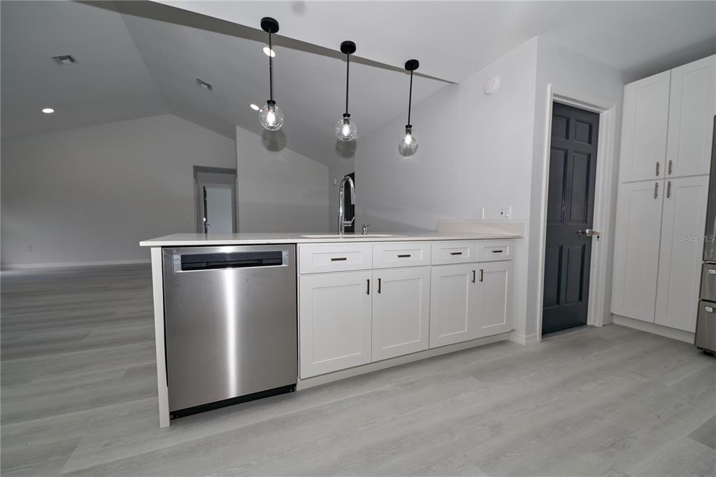 119 Ridgecrest Drive Eustis, FL 32726 - Photo 33 of 52 a kitchen with a stove a sink and a refrigerator