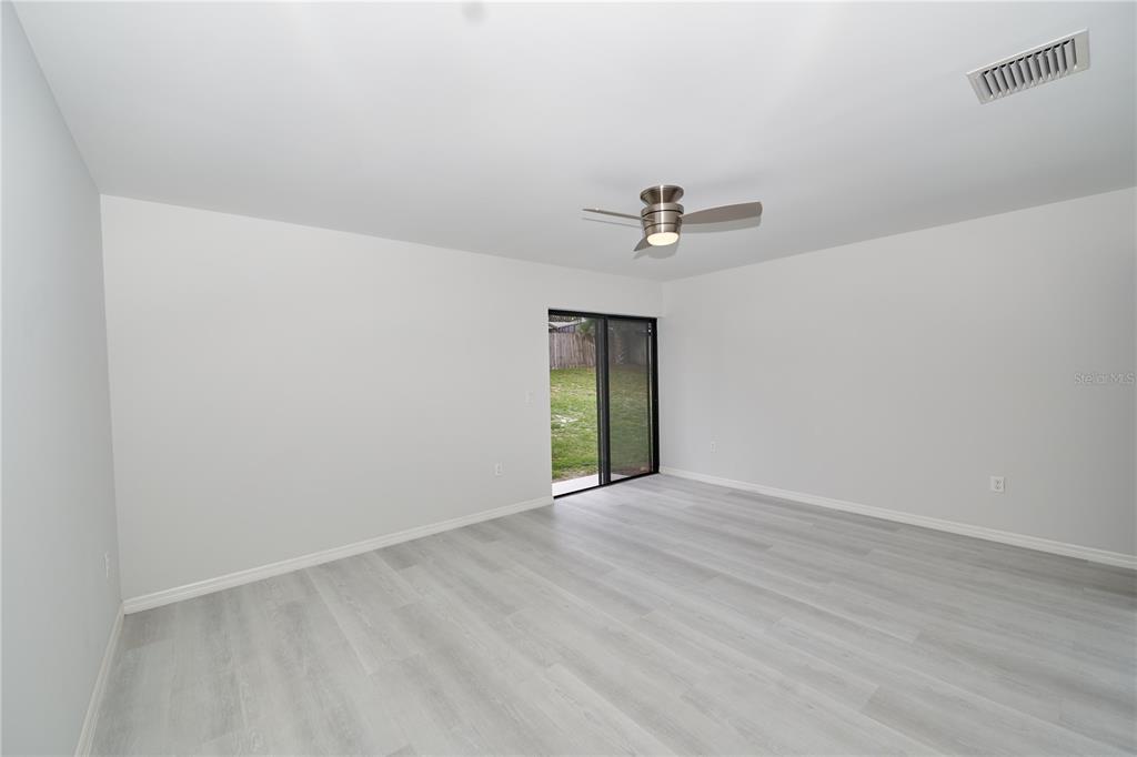 119 Ridgecrest Drive Eustis, FL 32726 - Photo 42 of 52 a view of an empty room with a window