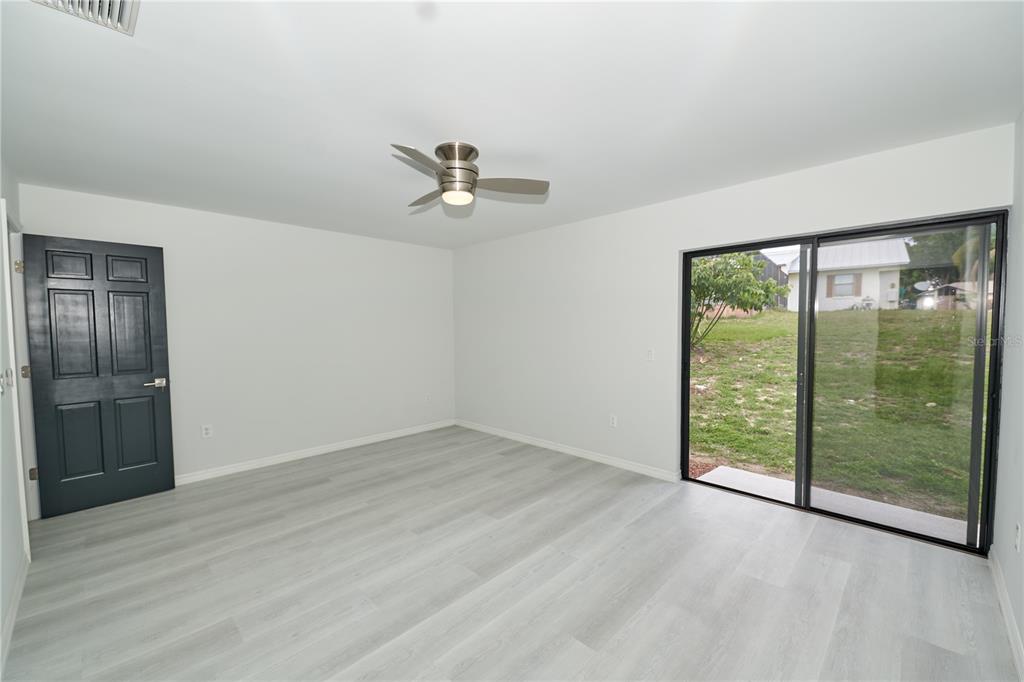 119 Ridgecrest Drive Eustis, FL 32726 - Photo 43 of 52 wooden floor in an empty room with a window