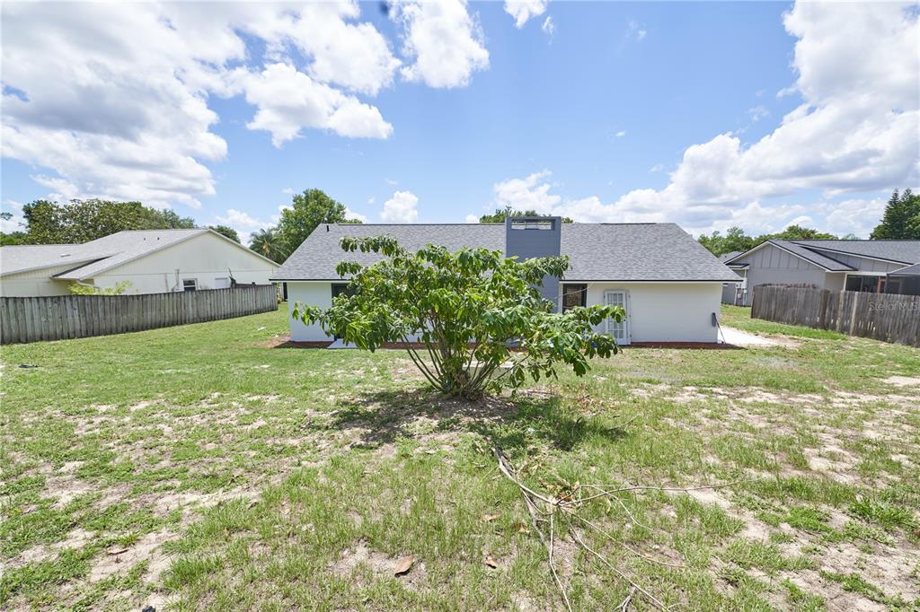 119 Ridgecrest Drive Eustis, FL 32726 - Photo 52 of 52 a view of a house with a big yard and large tree