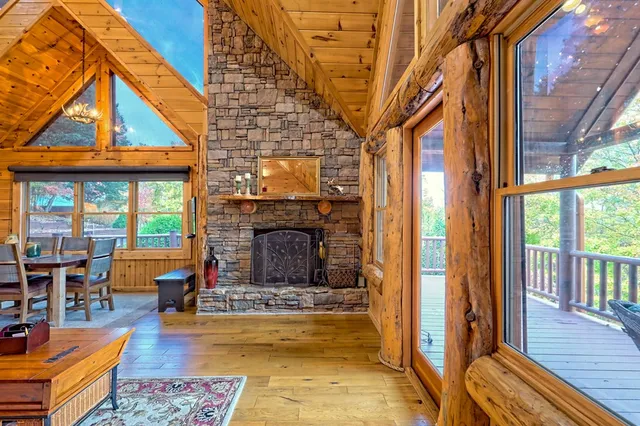 a view of a house with a small yard and wooden fence