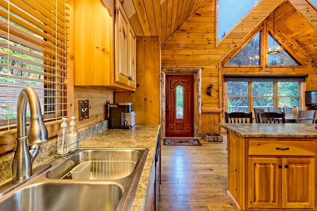 a aerial view of a house with table and chairs in it