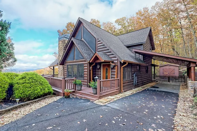 a view of a balcony with wooden floor and staircase