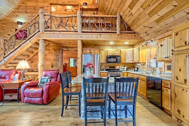 a view of living room kitchen and entryway