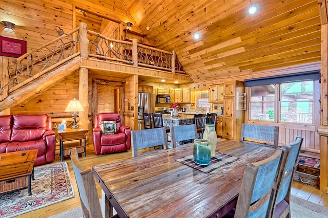 a spacious bedroom with a bed and wooden floors