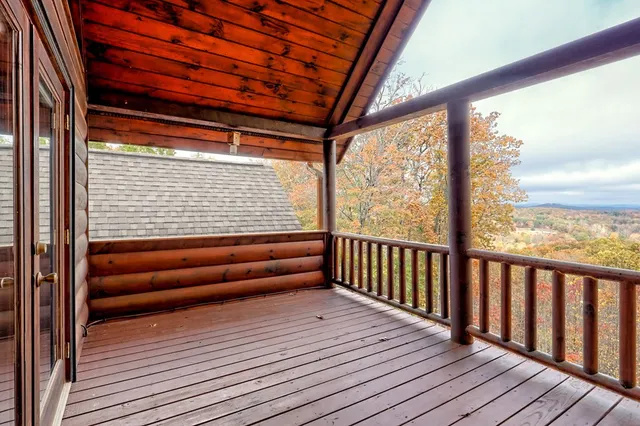 a view of a porch with wooden floor