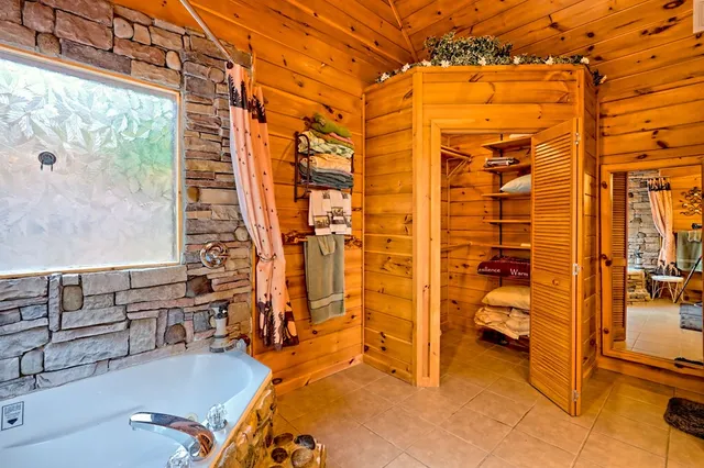 a view of a house with a small yard and wooden fence