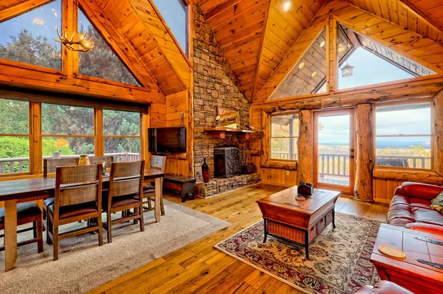 a view of a house with swimming pool and sitting area