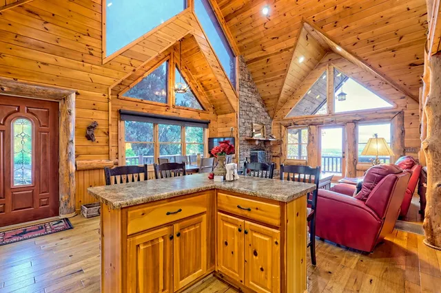 a kitchen with stainless steel appliances granite countertop a refrigerator stove and sink