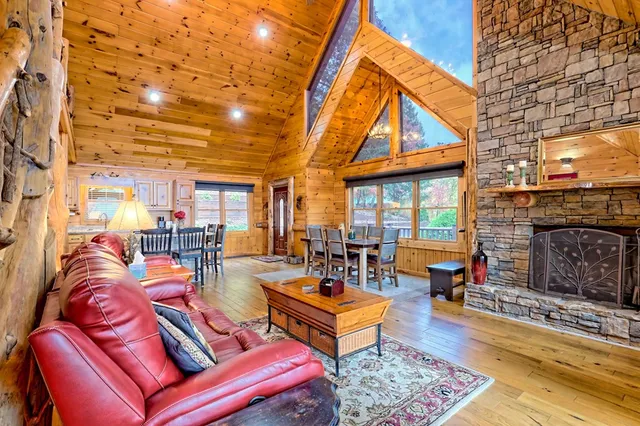 a kitchen with kitchen island granite countertop a sink stove and cabinets
