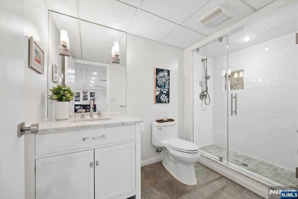 39 Eagle Nest Road Morris Township, NJ 07960 - Photo 35 of 43 a bathroom with a toilet sink and shower