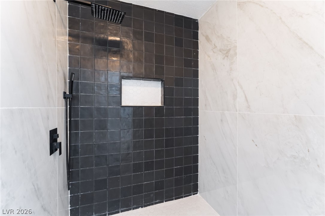 4980 Ridge Drive Las Vegas, NV 89103 - Photo 20 of 36 Bathroom featuring a tile shower