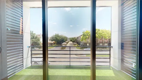 a view of front door with wooden floor