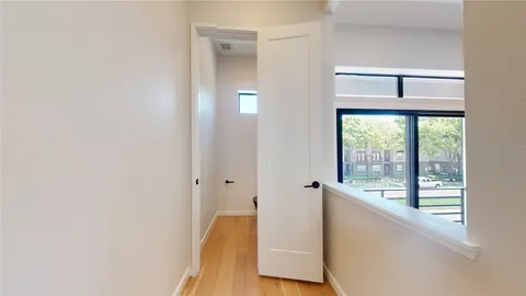 a view of an entryway with wooden floor