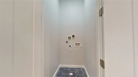 a view of an empty room with a bathroom