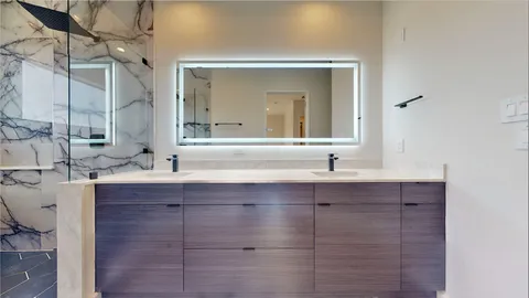 a spacious bathroom with a tub and a sink