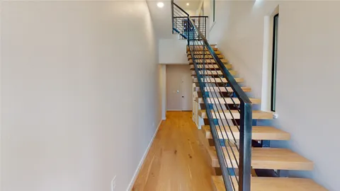 a view of entryway with wooden floor