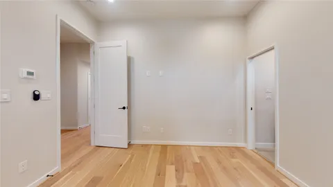 a view of wooden floor in an empty room