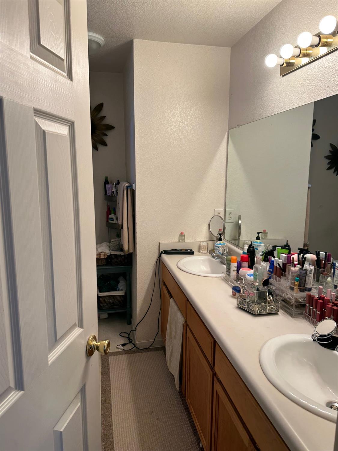 596 St Teresa Street Merced, CA 95341 - Photo 17 of 22 a bathroom with a sink double vanity and a mirror
