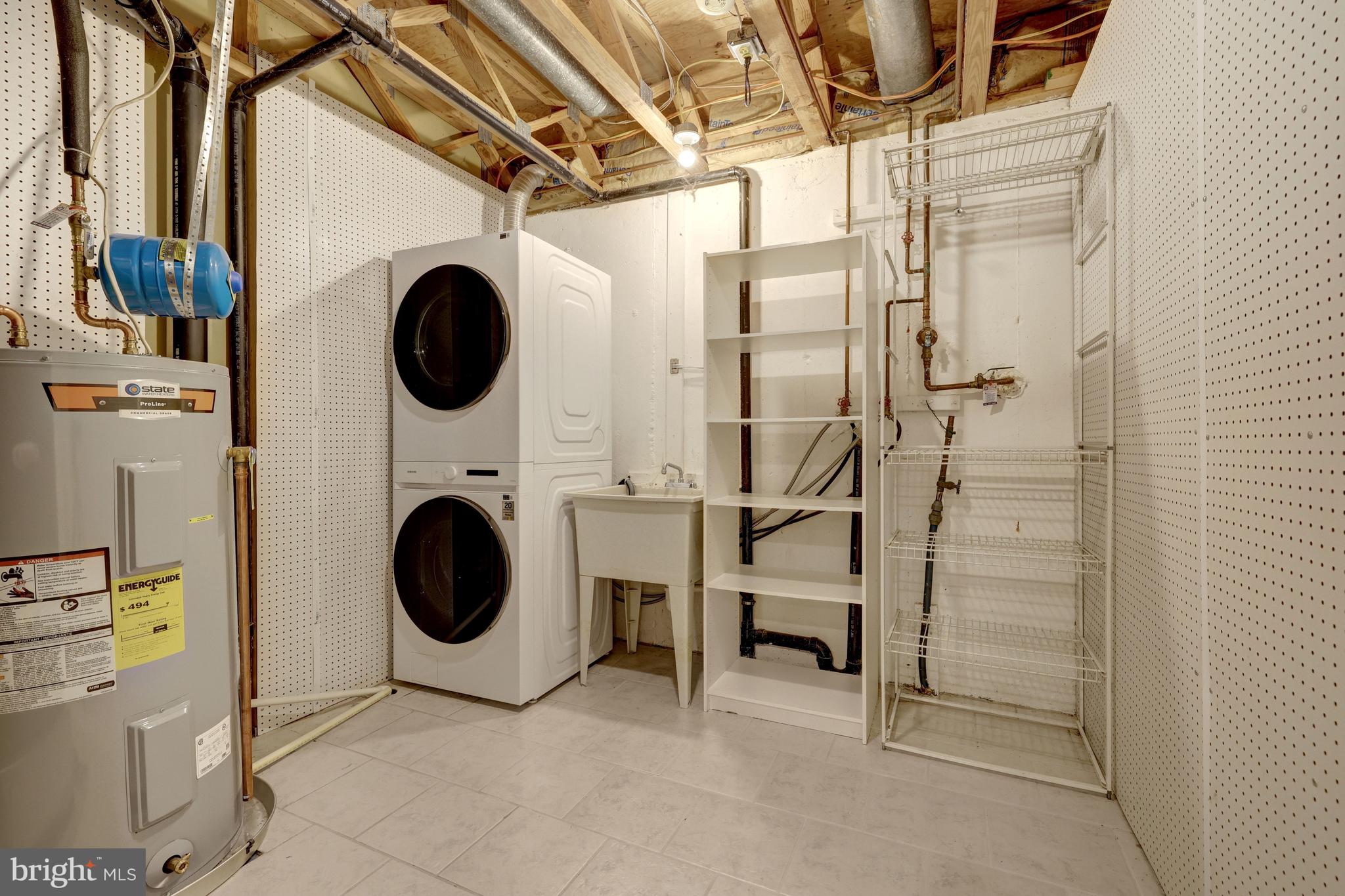 11992 Sentinel Point Court Reston, VA 20191 - Photo 40 of 49 New washer and dryer (2025) in utility room