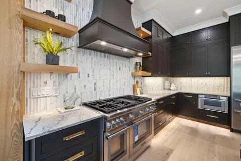 an open kitchen with a table and chairs in it