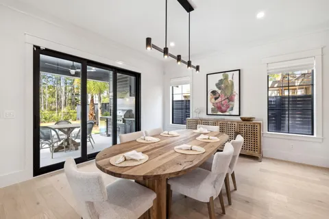 a large kitchen with a table and chairs