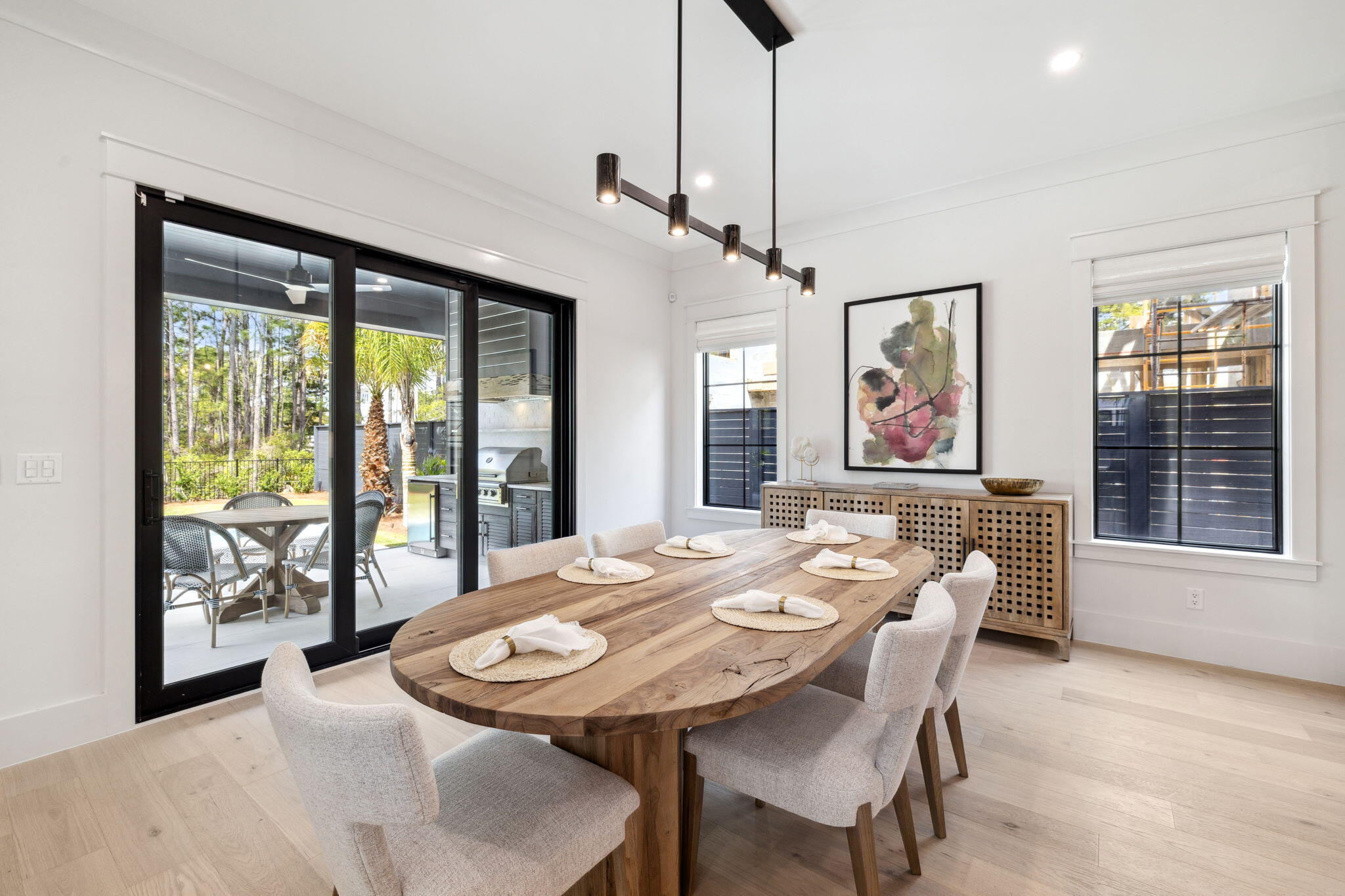 20 Loon Lake Drive Santa Rosa Beach, FL 32459 - Photo 18 of 54 a dining room with furniture a chandelier and wooden floor