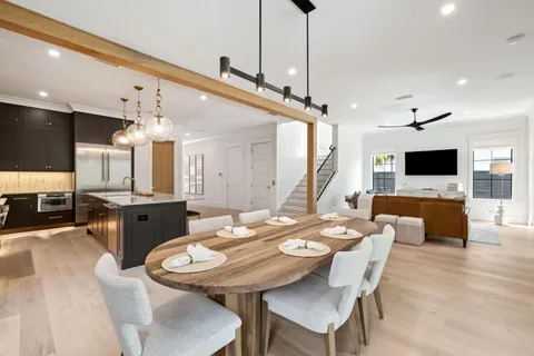 a living room with furniture and kitchen view