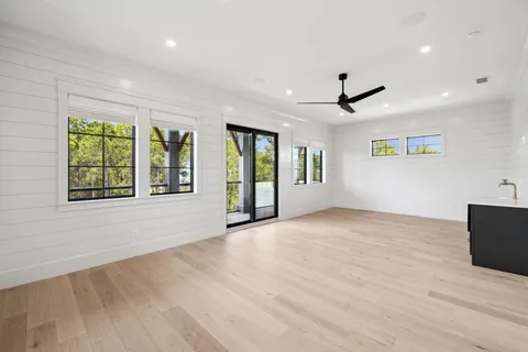 a view of a kitchen with a sink and a window