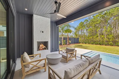 a view of a swimming pool with an outdoor seating
