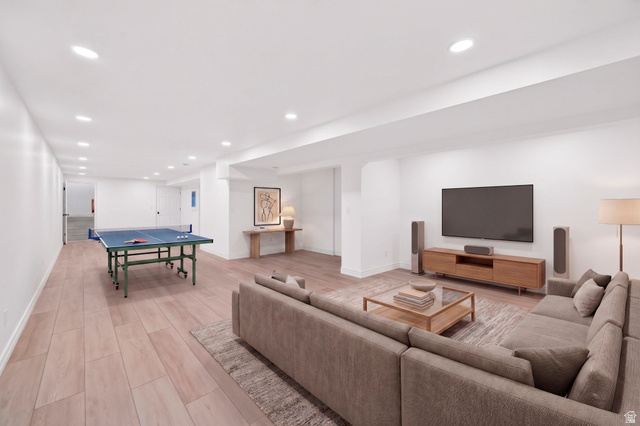 6969 South 855 East Midvale, UT 84047 - Photo 11 of 55 Spacious finished lower level featuring recessed lighting, light wood-finish flooring, and crisp white walls