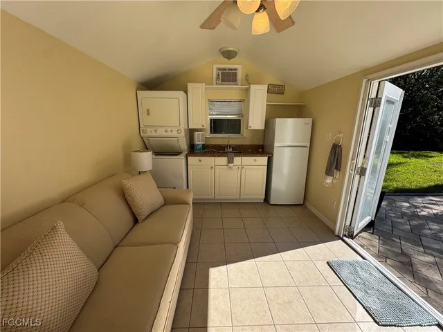 a living room with a couch and a rug
