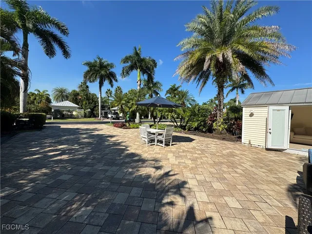 a view of a backyard with a patio