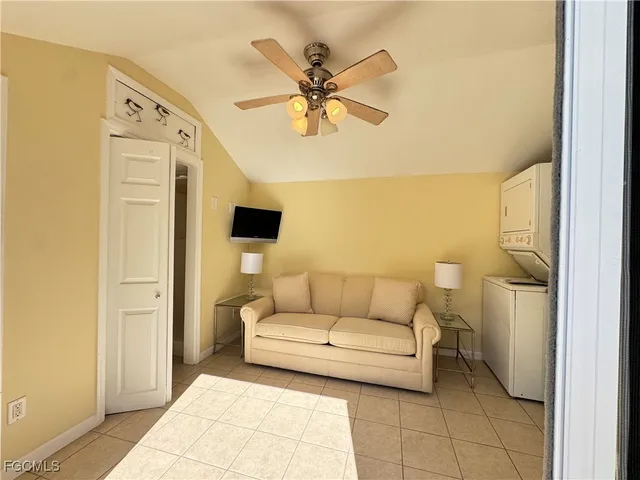 a living room with furniture and a rug