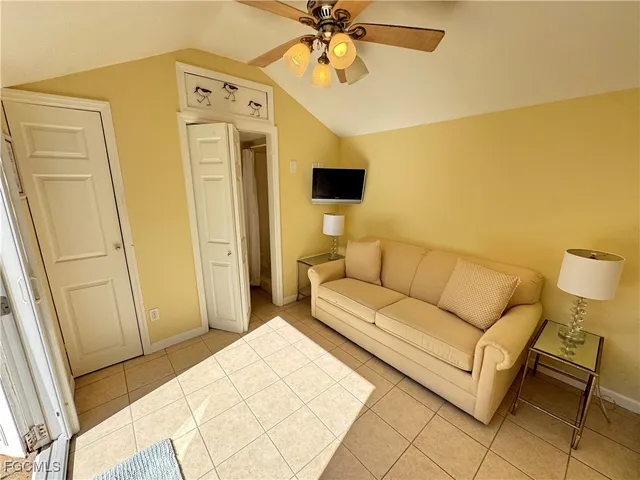 a living room with a couch and a dining table