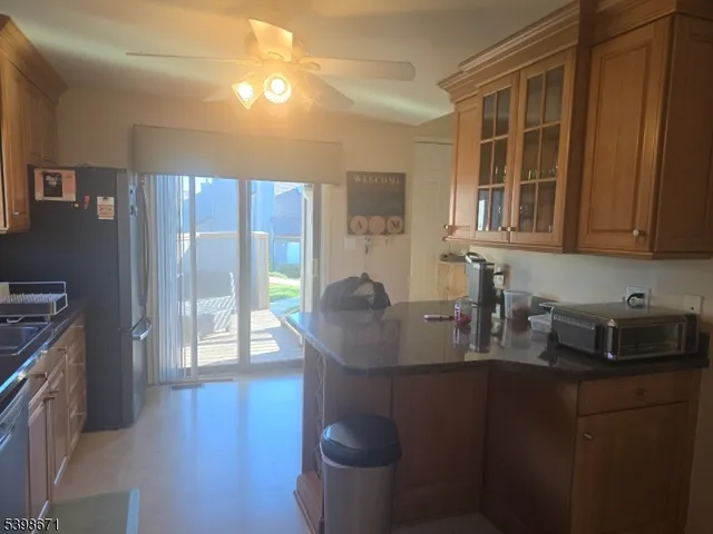 a kitchen with a stove a sink and a refrigerator