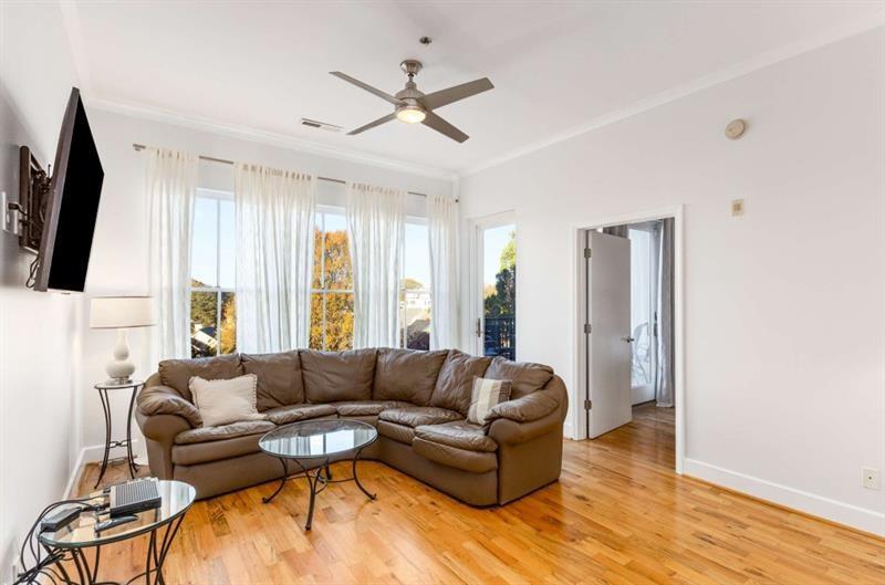 384 Ralph McGill Boulevard Northeast, Unit 313 Atlanta, GA 30312 - Photo 13 of 31 a living room with furniture and a large window