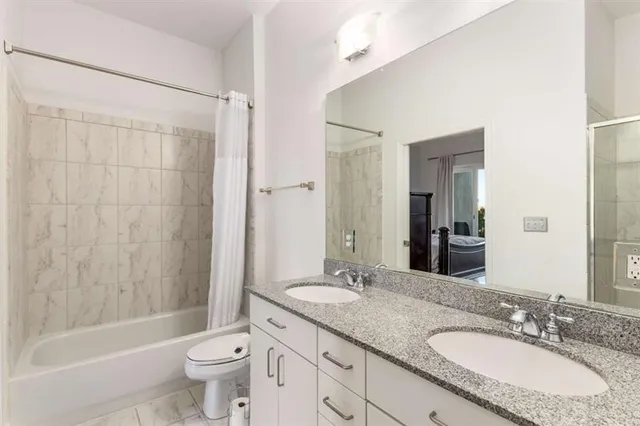 a bed room with a bed and a television