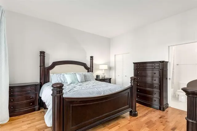 a bedroom with a bed and a television