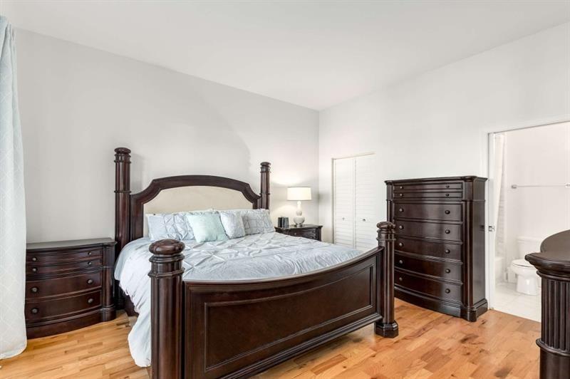 384 Ralph McGill Boulevard Northeast, Unit 313 Atlanta, GA 30312 - Photo 17 of 31 a bed room with a bed and a television