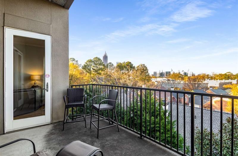 384 Ralph McGill Boulevard Northeast, Unit 313 Atlanta, GA 30312 - Photo 26 of 31 a view of a balcony with chair and table