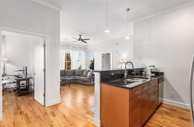384 Ralph McGill Boulevard Northeast, Unit 313 Atlanta, GA 30312 - Photo 5 of 31 a kitchen with sink refrigerator and stove