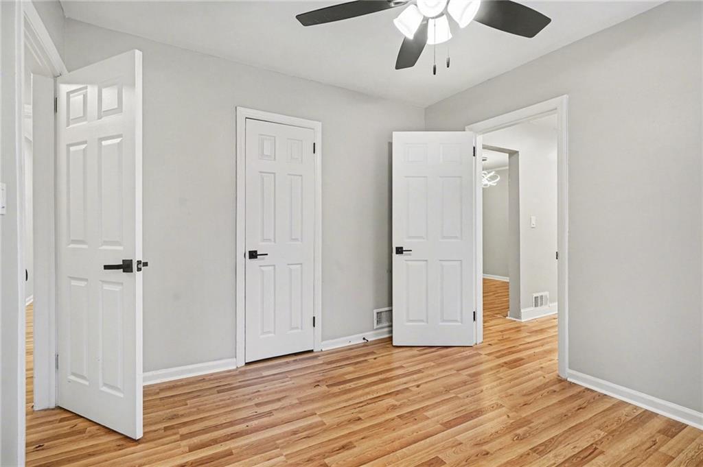 2912 Belvedere Lane Decatur, GA 30032 - Photo 13 of 25 a view of an empty room with wooden floor