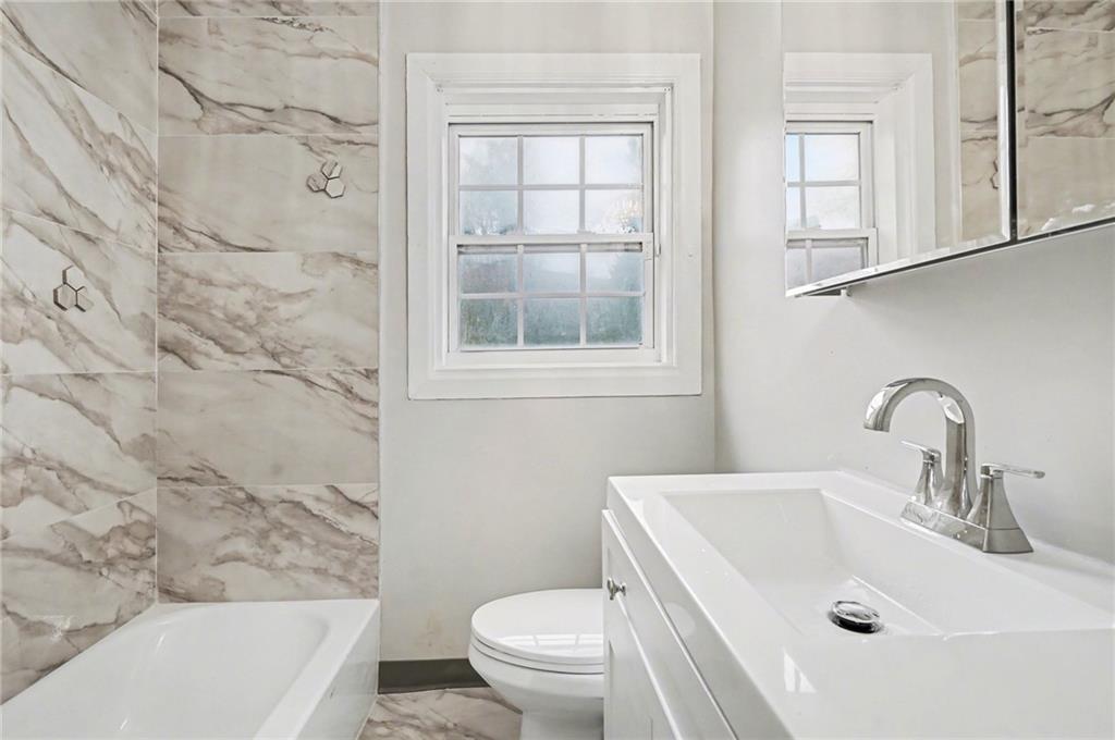 2912 Belvedere Lane Decatur, GA 30032 - Photo 14 of 25 a bathroom with a sink and a toilet