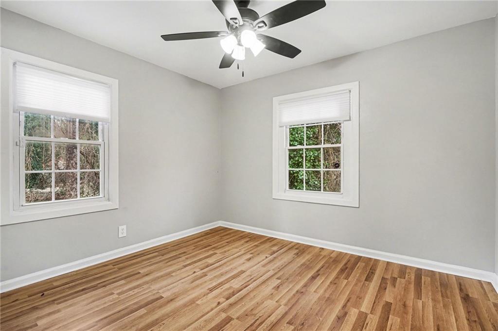 2912 Belvedere Lane Decatur, GA 30032 - Photo 17 of 25 a view of an empty room with wooden floor and a window