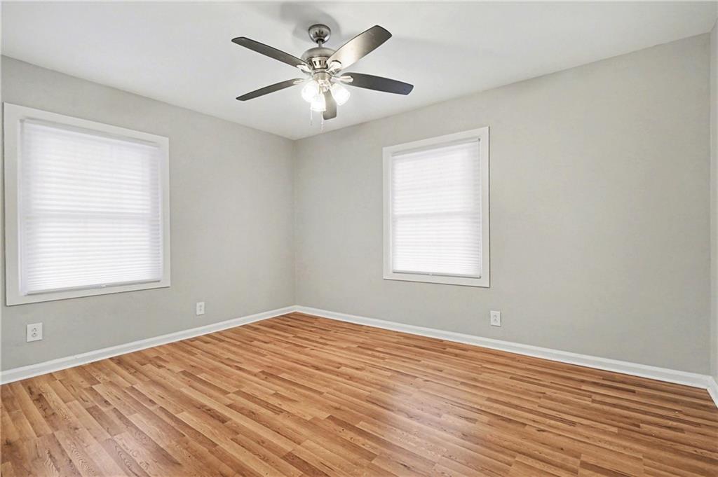 2912 Belvedere Lane Decatur, GA 30032 - Photo 20 of 25 a view of an empty room with wooden floor and a window