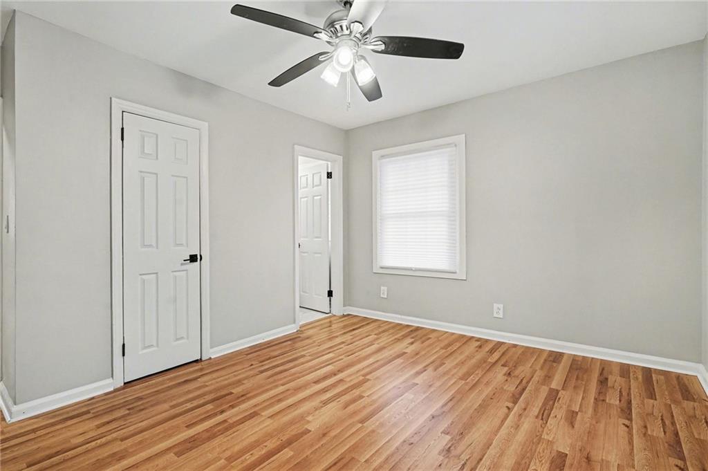 2912 Belvedere Lane Decatur, GA 30032 - Photo 21 of 25 a view of a room with wooden floor and a ceiling fan