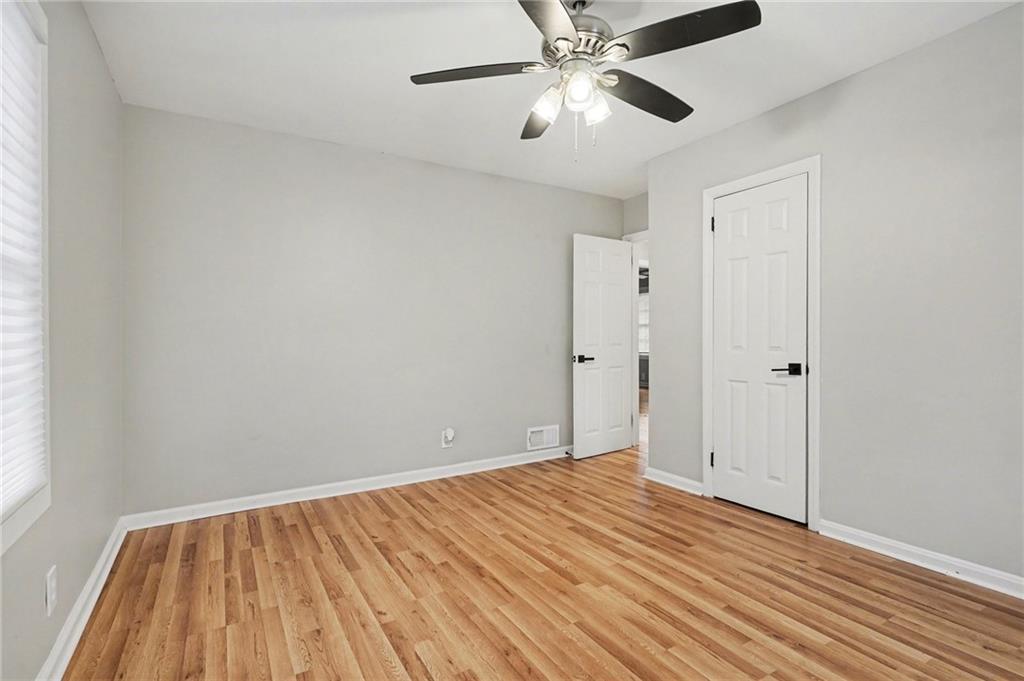 2912 Belvedere Lane Decatur, GA 30032 - Photo 22 of 25 a view of an empty room with wooden floor