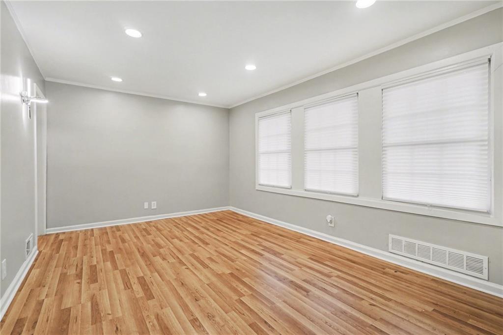 2912 Belvedere Lane Decatur, GA 30032 - Photo 4 of 25 a view of empty room with wooden floor and fan